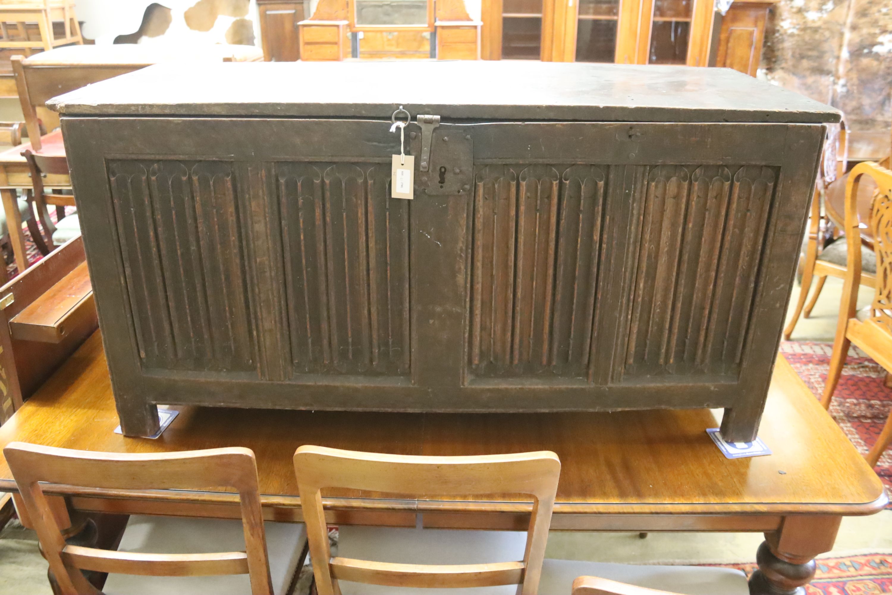 A carved and panelled oak chest, length 129cm, depth 51cm, height 63cm